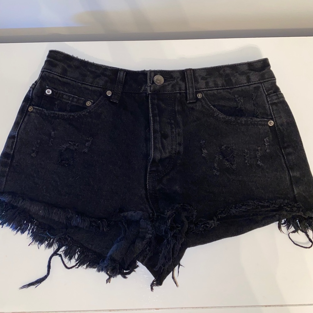 Ripped black denim shorts